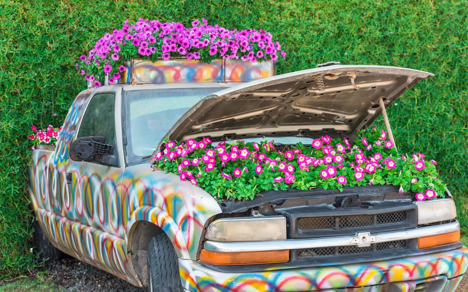 Car adorned with colorful flowers.